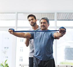 IMAGE 3 — Nurse helping elderly patient with arm movement