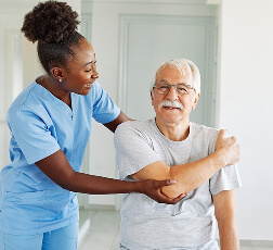 IMAGE 4 — Patient using resistance band with physiotherapist